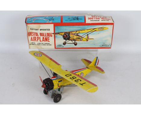 Straco - A boxed tinplate Bristol Bulldog airplane. # S-4103. The battery powered model appears in Very good condition showin