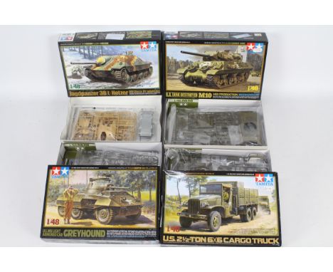 Tamiya - Four boxed plastic model military vehicle kits in 1:48 scale by Tamiya. Lot consists of Tamiya #32551 US M8 Greyhoun