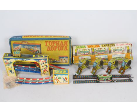 CCCP - HEC Agrawal - 2 x boxed tinplate clockwork train sets, a Russian mountain cog railway set and a Ganga Yamuna Express R
