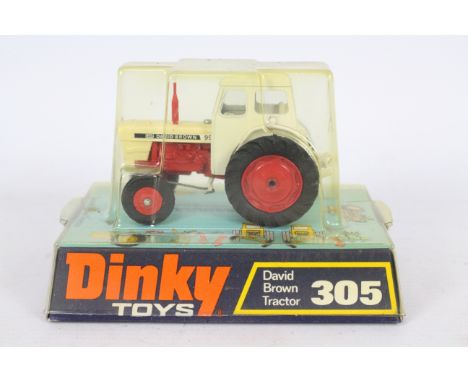 Dinky - A 1970s Dinky David Brown Tractor # 305. This is unsold shop stock so the model appears Near Mint with only some tiny