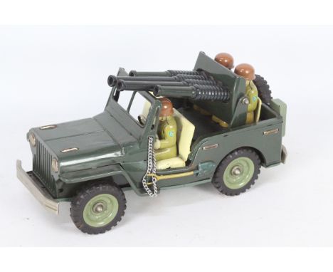 Japan SSS Large Tin Anti Aircraft Jeep, Item appears to be in good condition, rear gun is loose, no box, measures 11.5". (Thi