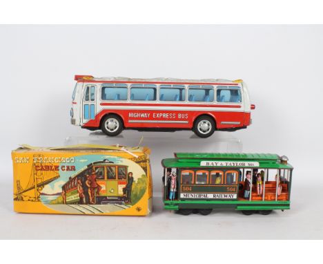 Nomura - TE - 2 x tinplate toys, a boxed San Francisco Cable Car and an unboxed Nomura Highway Express Bus. The Cable Car app