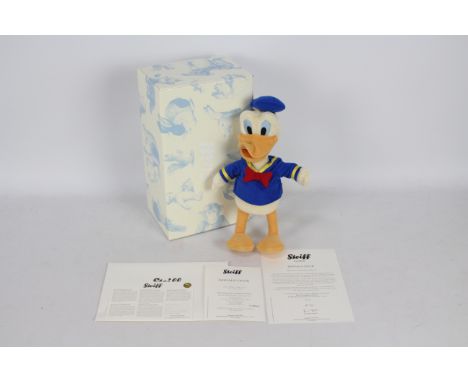 Steiff - A boxed Steiff Disney Limited Edition #354984 'Donald Duck'. The toy stands 25cm in height and comes with Steiff but
