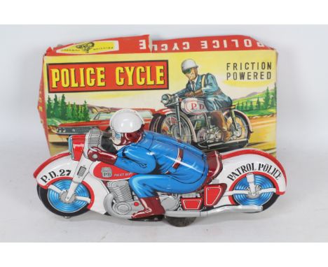 Haji - A boxed vintage Haji tinplate friction powered Police Motorcycle # 2799. The model appears in Good condition but has a