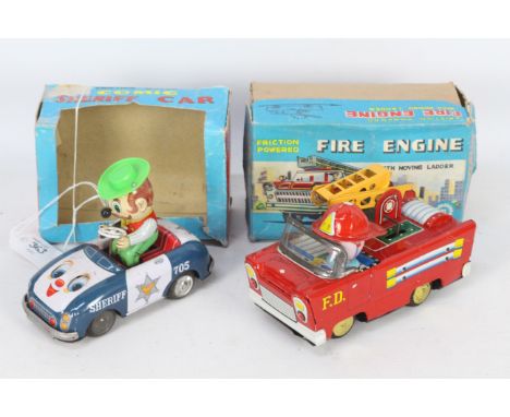 H Toys - A1 Toys - 2 x boxed vintage Japanese friction powered vehicles, a Sheriff car with a bouncing Sheriff and moving eye