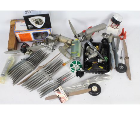 A mixed lot to include a MFA power panel, 7 model aircraft engines some with attached props, engine parts and approx. 20 mode