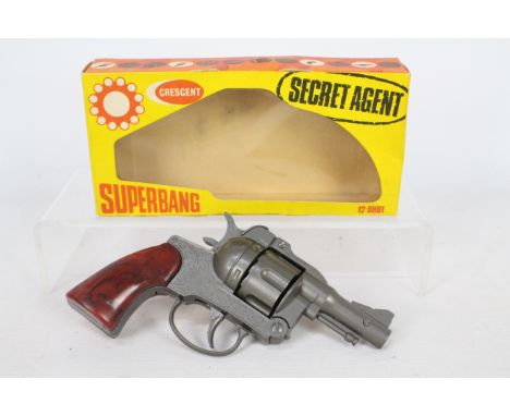 Crescent - A boxed vintage Crescent Secret Agent Superbang 12 shot cap gun. The gun appears in Near Mint condition with only 