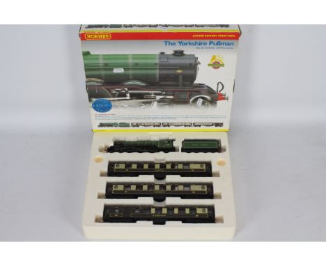 Hornby - A boxed Yorkshire Pullman 4-6-2 00 gauge steam loco and coach set with light storage wear, the loco and coaches appe