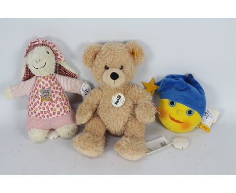 Steiff - Three Steiff plush toys. Lot includes Steiff Original #111327 Flynn; with button and label to ear plus swing tags to