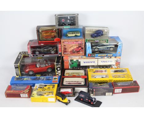 Ertl, Joal, Lledo, Jadi, Corgi, Others - A collection of boxed diecast model vehicles in various scales. Lot includes a Jadi 
