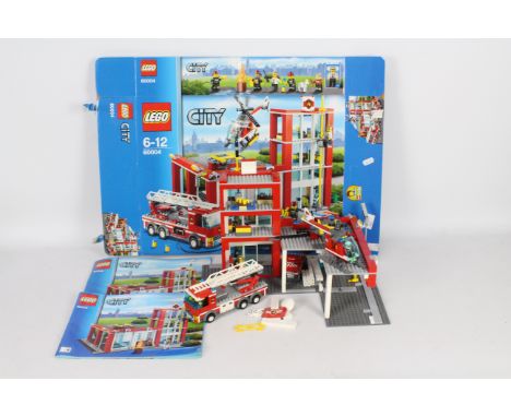 Lego - City Fire Station with helipad/copter/2 fire trucks. # 60004 Item appears to be in good condition. Item is assembled s