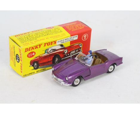 Dinky - A boxed # 114 Triumph Spitfire in the rare purple colour. The car appears in Near Mint condition with just a couple o