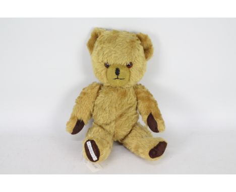 Pedigree - A vintage 1950 Pedigree golden mohair bear, with jointed arms and legs, black vertically stitched nose and mouth, 