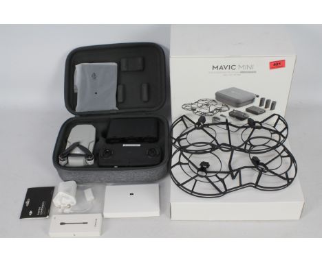 A DJI Mavic Mini Combo - Ultra light and Portable Drone, 30 min. Flight Time, Transmission 2 Km, 3-Axis Gimbal, 12MP, Video H