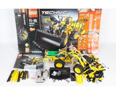 Lego - Technic Volvo digger # 42030. Item is part assembled and so cannot be checked for completeness. Parts appear in good c