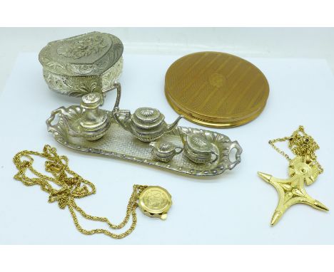 A miniature tea service and tray, a compact, mirror a/f, a heart shaped trinket box, a cross pendant and chain, and a SOS Tal