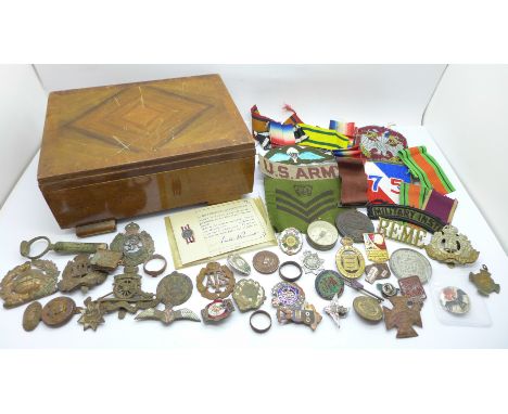 Military badges, cap badges, medal ribbons, a silver and enamel Royal Army Ordnance Corps brooch, a/f, On War Service 1915 ba