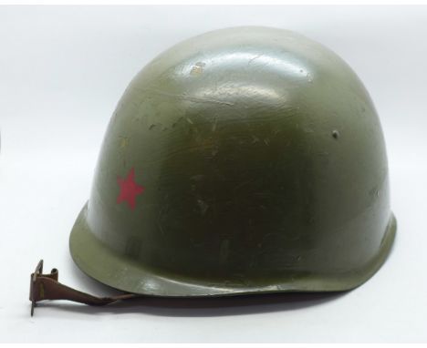 A Czechoslovakian Army helmet painted in Russian colours 