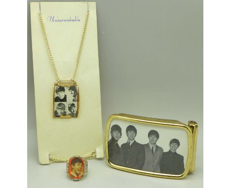Beatles jewellery; a ring, belt buckle and a pendant and chain 