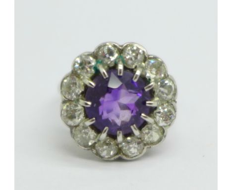 A platinum set, amethyst and diamond cluster ring, approximately 1.5ct diamond weight, 5.9g, M, (cluster 15/16mm diameter) 