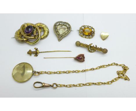 A collection of Victorian jewellery including a pinchbeck purple stone set brooch, a citrine colour stone set brooch, a bar b