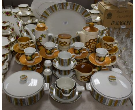 A Midwinter Sienna dinner service to include dinner plates, side plates, cups and saucers, lidded tureens, large oval platter