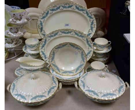A Royal Worcester Ferncroft pattern dinner service, pair of vegetable dishes, oval serving plates, dinner plates, cups and sa