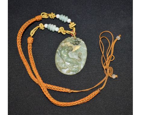 A 19th century Chinese jade Fo dog pendant