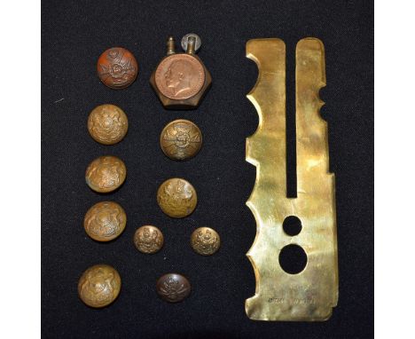A Trench Art lighter; military buttons and button polishing aids