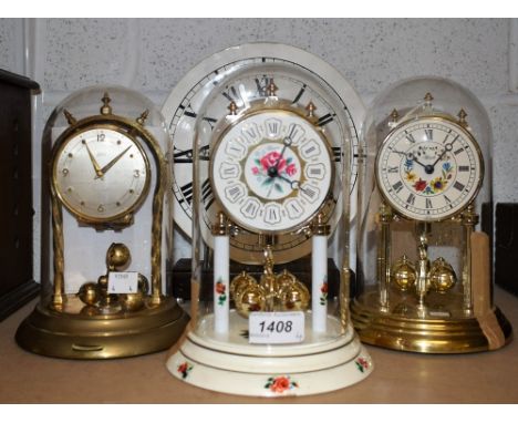 An anniversary clock, glass dome, two others, plastic domes, a mantel clock (4)