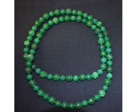 A string of Chinese jade beads, 36 inches long
