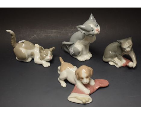 A Lladro model of a cat; others similar including Nao kittens, boxed (4)