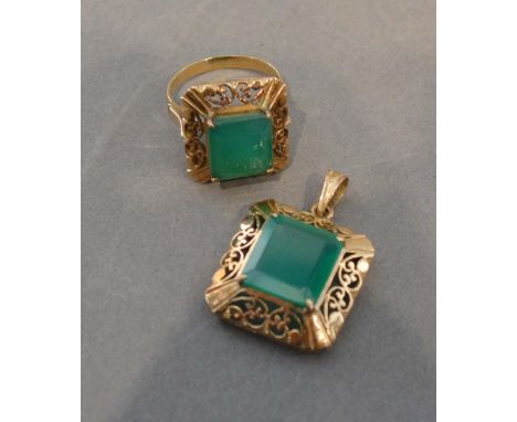 A Gold and Emerald Suite of Jewellery comprising a pendant with rectangular emerald within a pierced border, together with a 