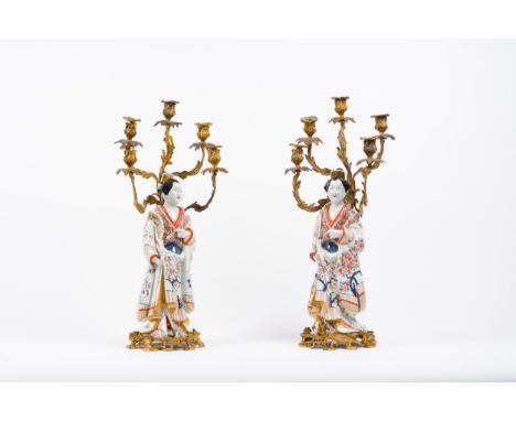 A pair of imari bijin porcelain figures mounted as five-light candelabraThe porcelain figures were mounted in Europe later, i