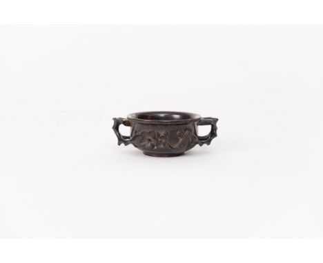 A carved and patinated zitan cupChina, Qing dynasty, 18th centuryFinely decorated with flowers in high-relief.Provenance: Fre