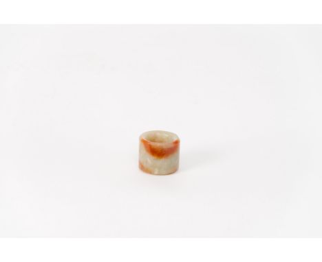A carved russet jade archer's thumb ringChina, Qing dynasty, late 19th centuryProvenance: French private collectionHeight: 2.