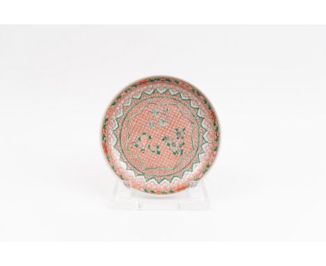 A famille verte dishChina, Qing dynasty, Kangxi period (1662-1722)Porcelain decorated with flowers painted in green overglaze