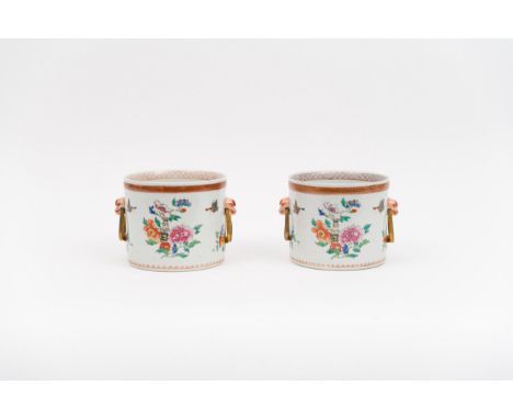 A pair of famille rose wine coolersChina, Qing dynasty, 18th centuryWith European gilt bronze handles, the porcelain finely d