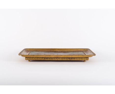 A gilt bronze trayEurope, 18th centuryMounted with a 18th century coromandel lacquer panel.Provenance: French private collect