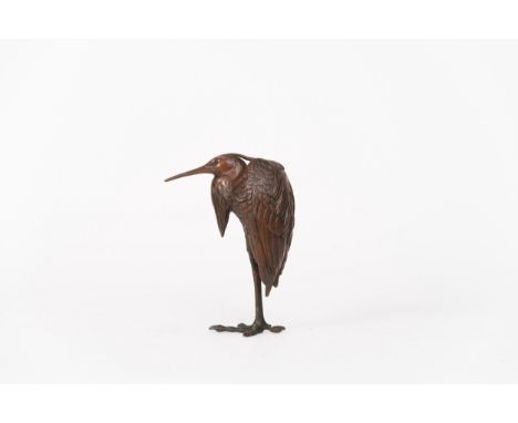 A cast patinated bronze model of a heronJapan, Meiji period (1868-1912)Standing on one leg with its head tucked into its wing
