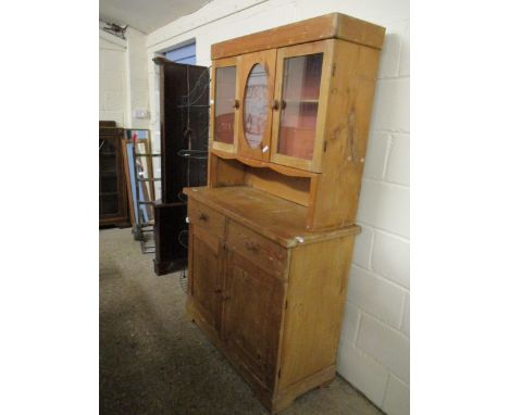 WAX PINE DRESSER WITH TWO GLAZED DOORS AND ETCHED PANEL OVER TWO DRAWERS WITH TWO PANELLED CUPBOARD DOORS WITH TURNED FEET 