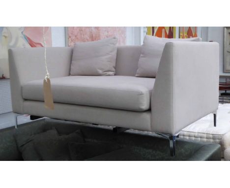 SOFA, contemporary neutral fabric finish on polished metal feet.