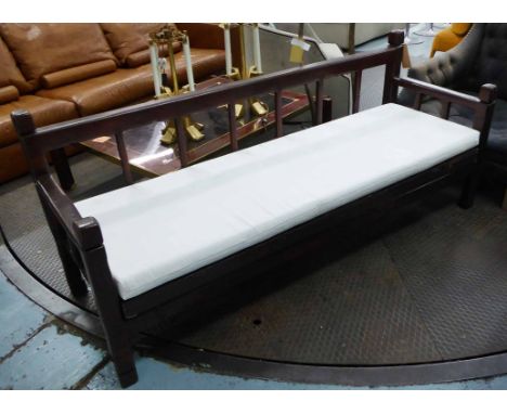 CONSERVATORY BENCH, with a white cushion, 197cm W x 85cm H. 