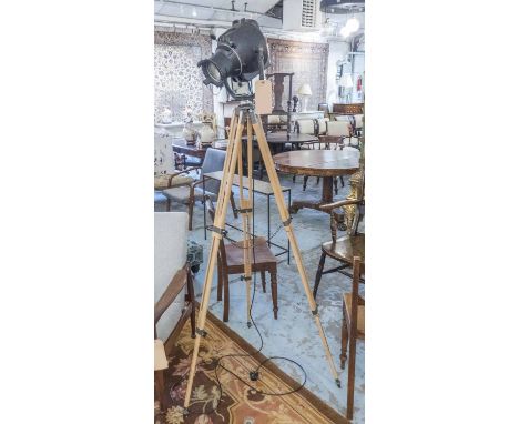 STUDIO LIGHT, 20th century by Strand Electric on wooden adjustable tripod supports, 130cm H approx.