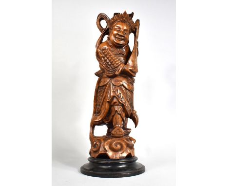 A Large Chinese Carved Wooden Figure Modelled as a Scholar Playing Lute, 49cm Overall 