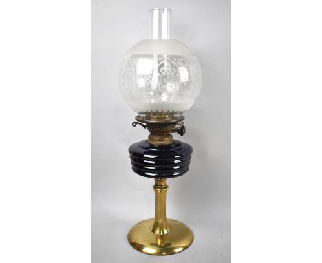 A Late Victorian/Edwardian Oil Lamp with Brass Support to Cobalt Blue Glass Reservoir, Complete with Acid Etched Globe Shade 