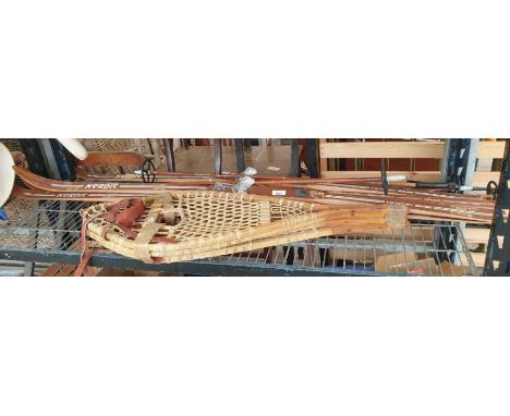 Set of Nordic Hickory based vintage skis and poles, along with vintage YAHO snow shoes.