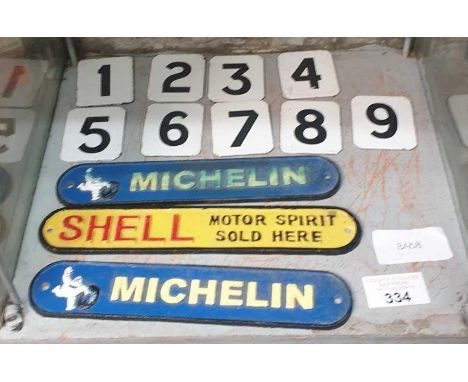 Enamel numbers from 1 to 9 along with 2 Michelin signs and one motor oil sign