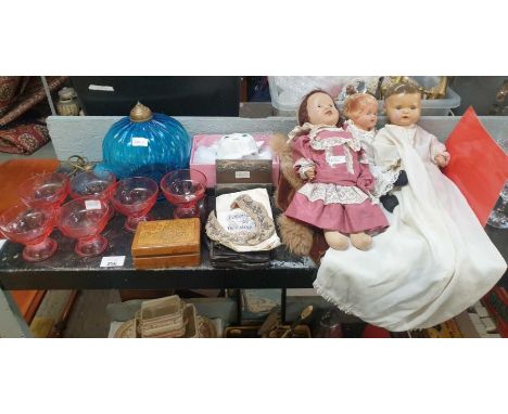 Three vintage dolls, a beaded collar, a blue glass light fitting and other items