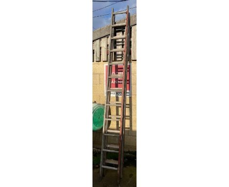Wooden double extending ladder along with a metal ladder